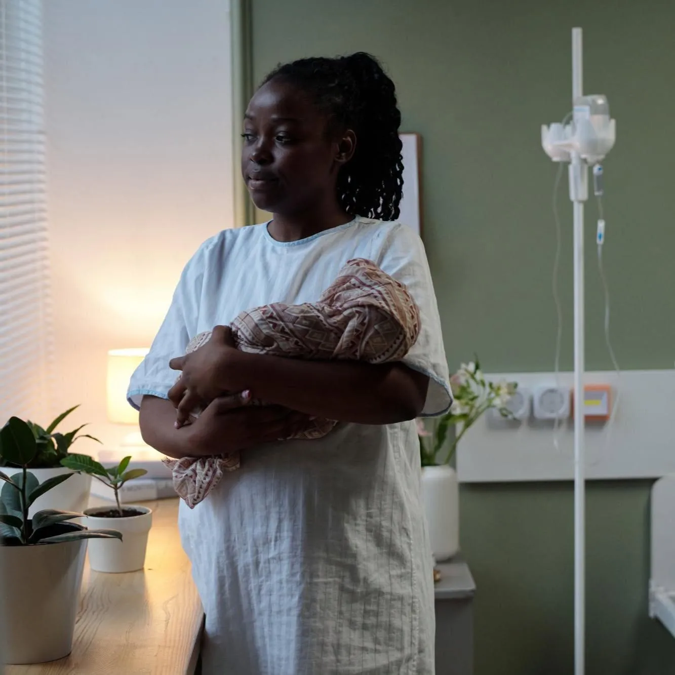 Mother carrying her baby