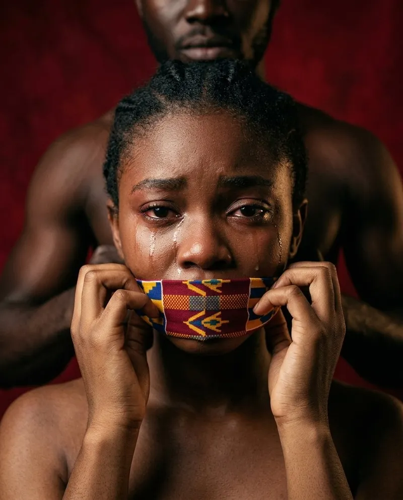 Ghanaian girl looking straight at the camera with a steady, defiant expression